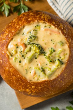 Homemade Broccoli Cheddar Soup Bread Bowl with Parsley