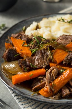 Homemade Beef Pot Roast with Carrots and Mashed Potatoes