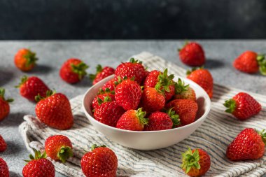 Raw Red Organic Sweet Strawberries in a Bowl Ready to Eat