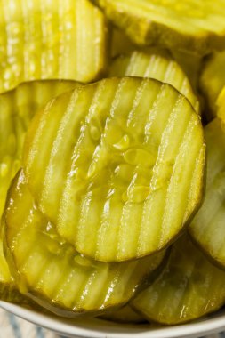 Homemade Preserved Dill PIckle Slices in a Bowl