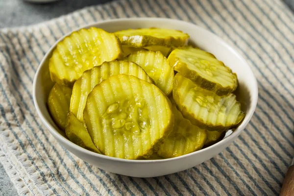 Homemade Preserved Dill PIckle Slices in a Bowl