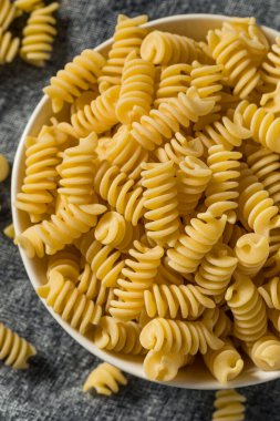 Raw Dry Organic Fusilli Pasta in a Bowl