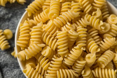 Raw Dry Organic Fusilli Pasta in a Bowl