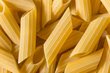 Raw Organic Pennoni Pasta in a Bowl