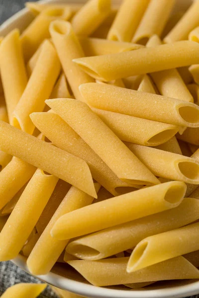 Raw Dry Mostaccioli Penne Lisce Pasta Skål — Stockfoto