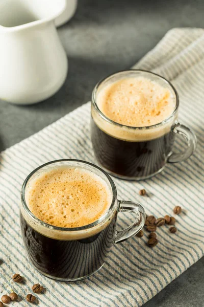 Warm Bulletproof Butter Coffee in a Glass Mug