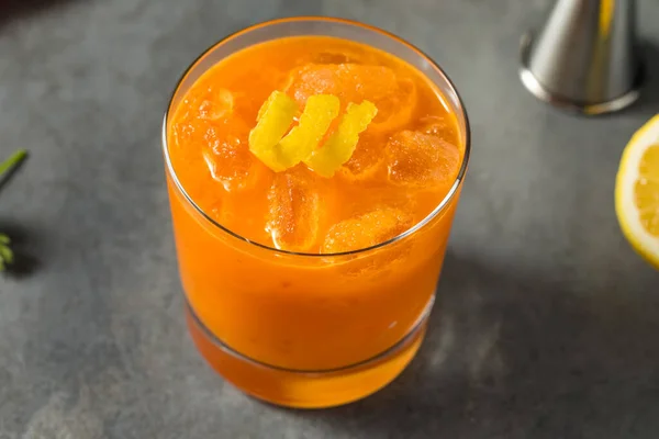 Cold Boozy Raw Carrot Bourbon Cocktail Lemon Juice — 스톡 사진