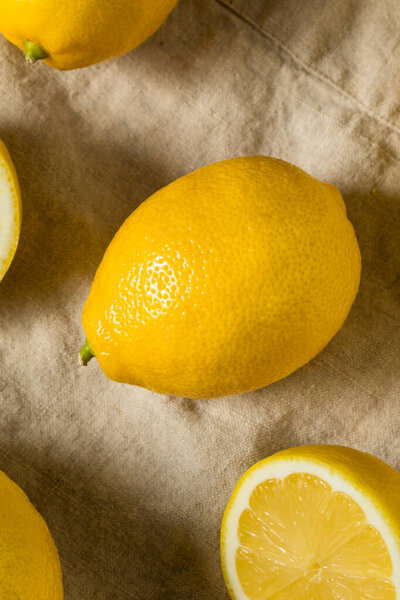Organic Raw Seedless Yellow Lemons in a Bunch