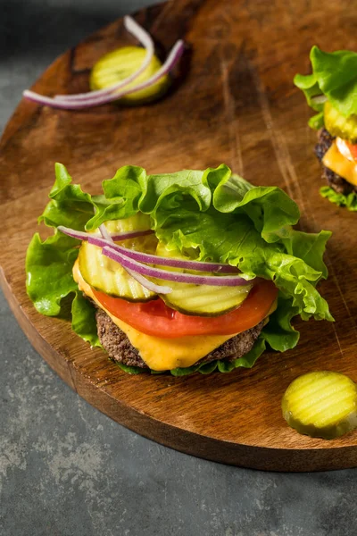 stock image Gluten Free Paleo Bunless Cheeseburger with Lettuce and Tomato