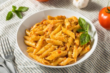 Homemade Tomato Pesto Pasta with Cheese and Basil