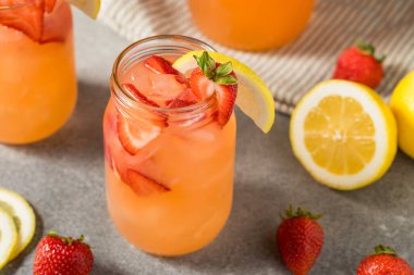 Cold Refreshing Strawberry Lemonade with Ice in a Glass