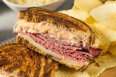Homemade Russian Reuben Sandwich with Cheese and Chips
