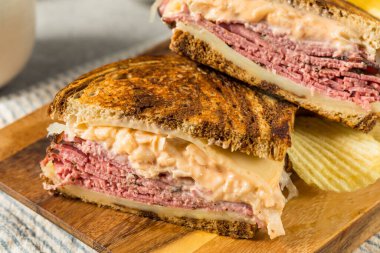 Homemade Russian Reuben Sandwich with Cheese and Chips