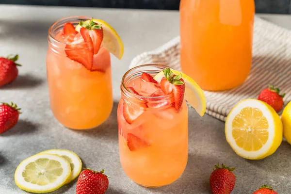 Cold Refreshing Strawberry Lemonade with Ice in a Glass