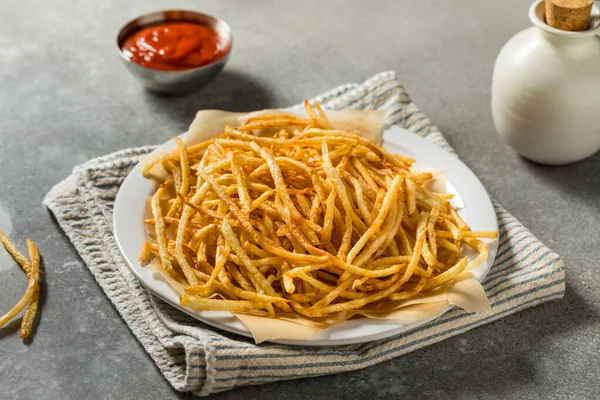 stock image Homemade Shoesttring French Fries with Salt and Ketchup