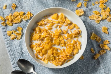 Sweet Organic Frosted Corn Flakes Cereal with Whole Milk clipart