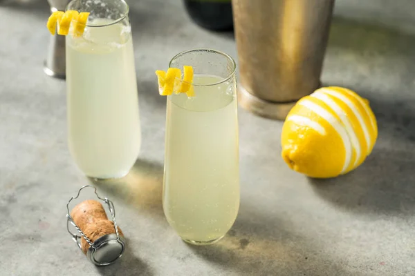 Bubbly Boozy French 75 Cocktail with Champagne and Lemon