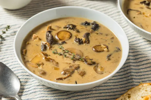 stock image Organic Homemade Mushroom and Wild Rice Soup with Bread