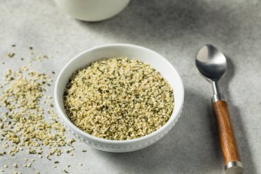 Raw Green Organic Hemp Seeds in a Bowl clipart