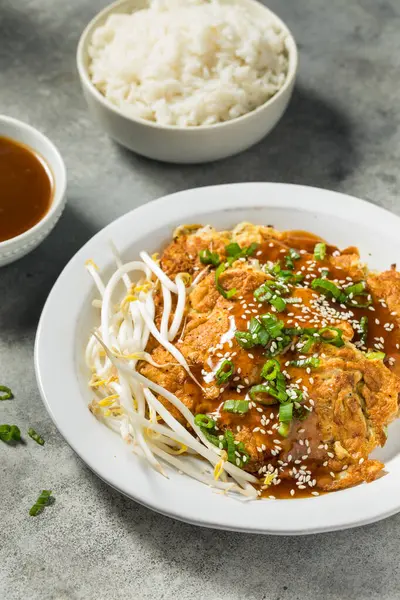 Fried Chinese Egg Foo Young  with Sauce and Rice