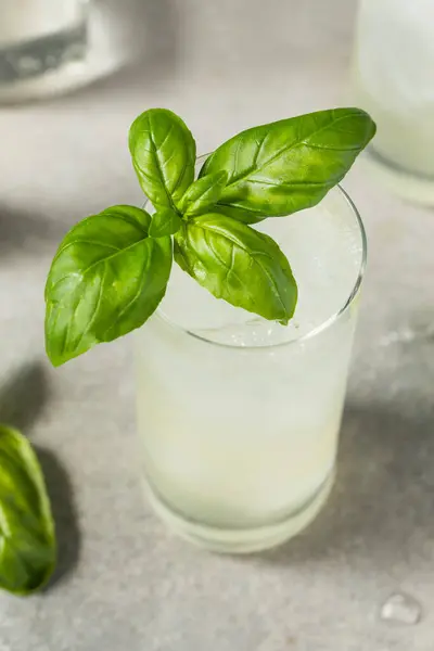 Stock image Boozy Cold Basil Highball Cocktail with Gin and Lime