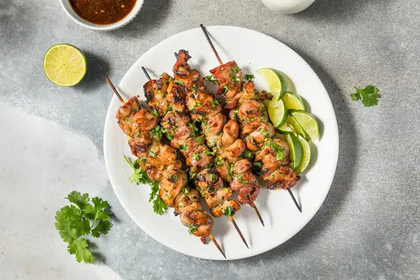 stock image Homemade Thai Pork Skewers with Lime and Cilantro