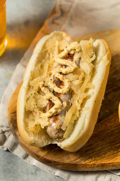 stock image German Homemade Bratwurst Sandwiches with Sauerkraut and Beer for Oktoberfest