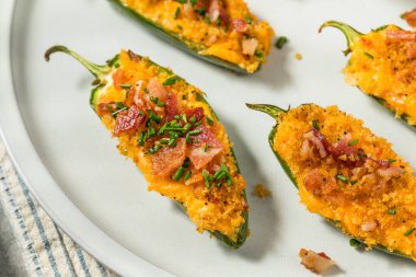 Homemade Jalapeno Poppers with Bacon and Bread Crumbs for an Appetizer clipart