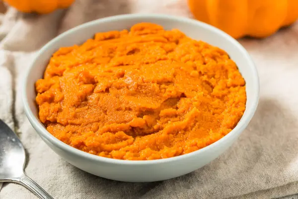 Stock image Organic Raw Orange Canned Pumpkin Puree in a Bowl to Cook With