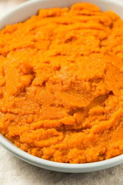 stock image Organic Raw Orange Canned Pumpkin Puree in a Bowl to Cook With