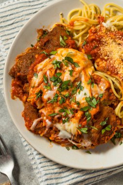 Italian Homemade Eggplant Parmesan Pasta with Red Sauce and Spaghetti clipart