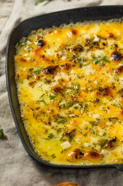 Warm Baked Fontina Cheese Dip with Herbs Garlic and Toasted Bread clipart