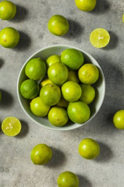 Sour Organic Green Key Limes in a Bowl Ready to Eat clipart