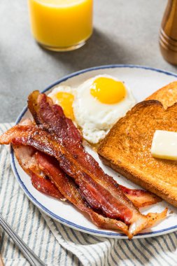 Healthy American Bacon Egg and Toast Breakfast with Orange Juice