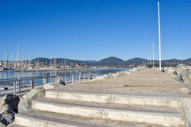 breakwater port Cogolin winter day with mountain view