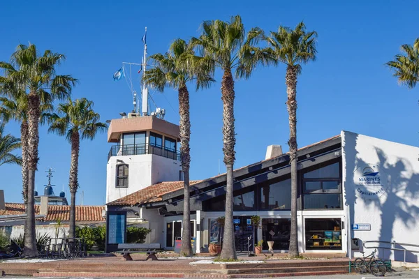 Port Cogolin winter day view yacht dock club marines building with palm trees