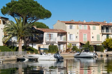 Port Grimaud house on river shore with yachts near the beach