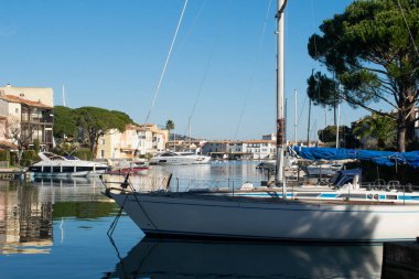 Port Cogolin house on river shore with yachts near the beach