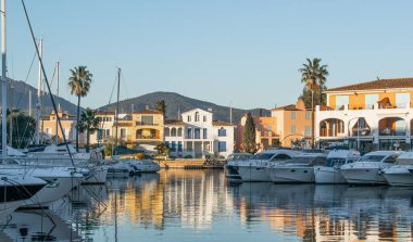 Port Cogolin house on river shore with yachts near the beach