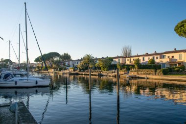 Port Grimaud house on river shore with yachts near the beach