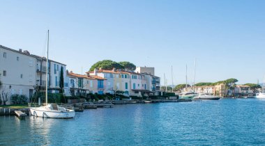Port grimaud hotels boats and river day time