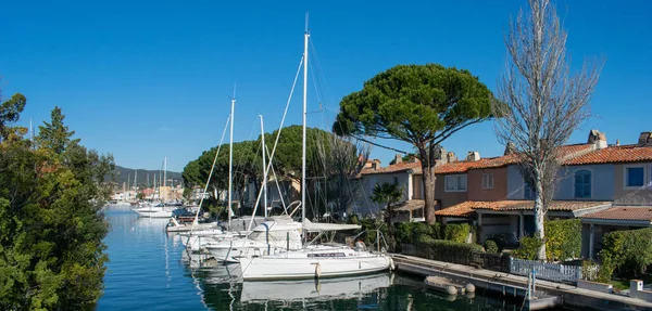 Port Cogolin house on river shore with yachts near the beach
