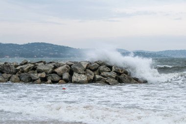Port Cogolin beach shore rainy day with wind and clouds