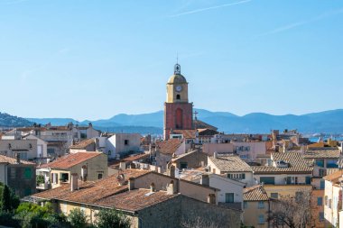 Saint Tropez church tower with clock against blue sky day time
