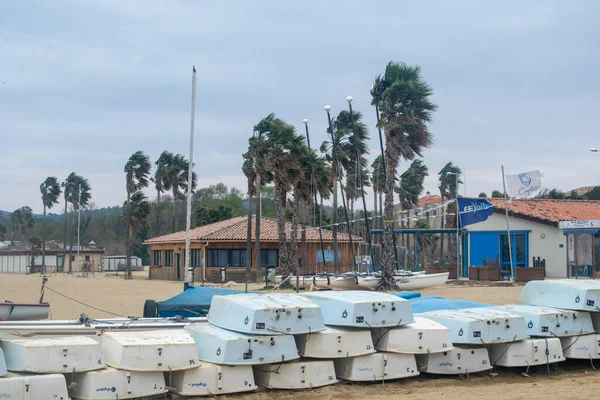 Port Cogolin boats on the seaside shore rainy day clouds