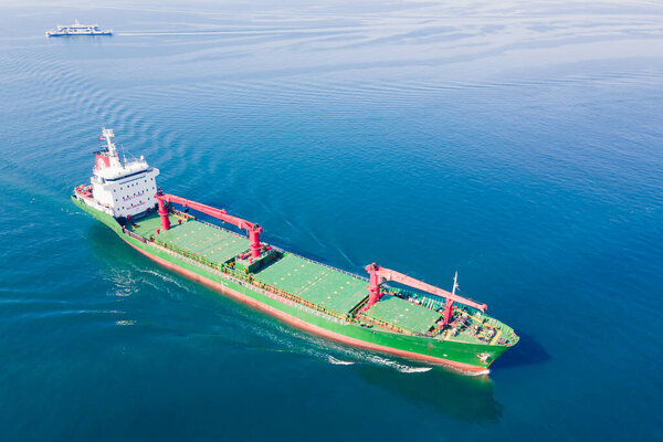 Bulk carrier or bulker is a merchant ship transport unpackaged bulk cargo, grains, ore, coal. Aerial wide shot
