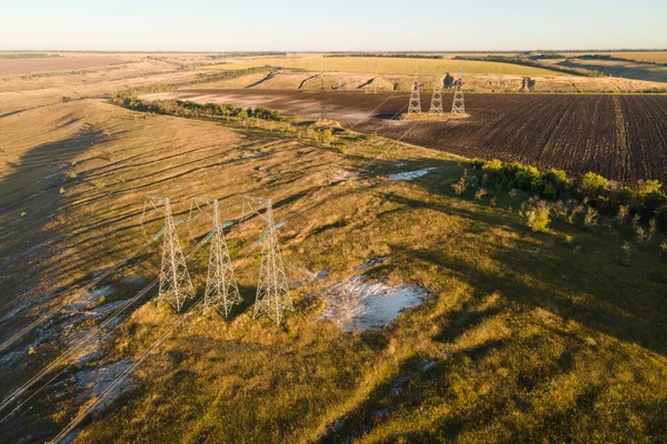 Transmission tower, power tower or electricity pylon, rural infrastructure. Aerial view