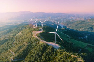 Energy windmills producing electric power zero emissions, close-up aerial shot clipart