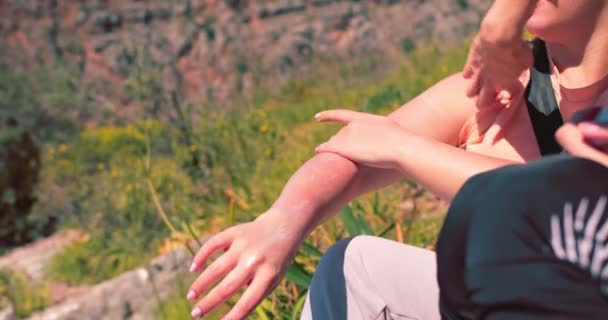 Female Tourist Applies Sunscreen Arm Sunburn High Mountains — Stock Video