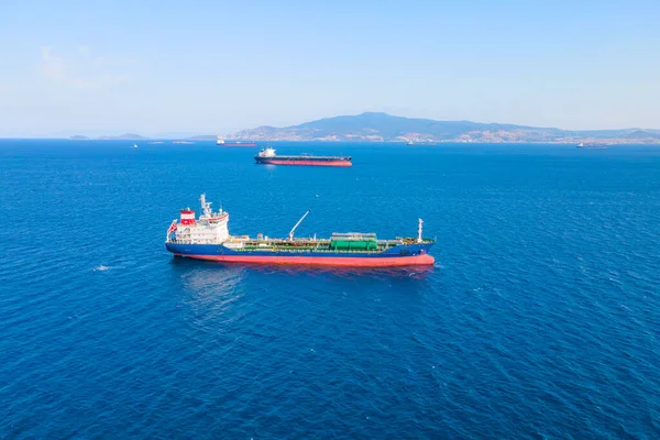 Oil chemical tanker carrier sea ship anchored in Aegean sea waiting entering port, Aerial view